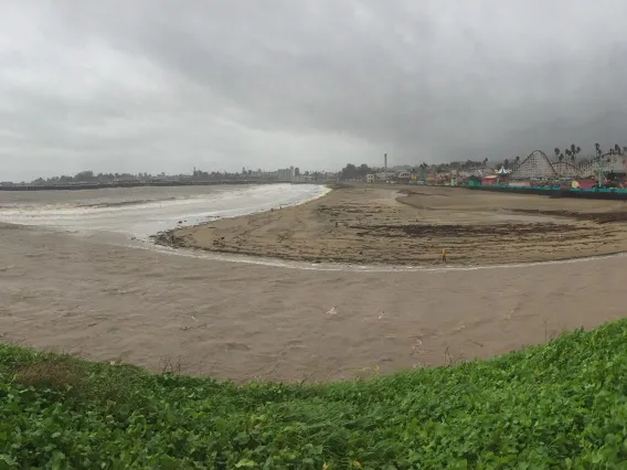 Photograph of a river with encroaching storm clouds.