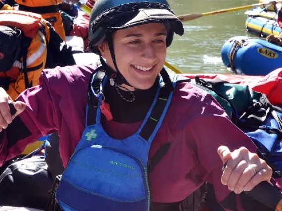 Ann Willis in a raft with other people on a river