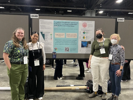 A group of four SWCASC NRWD Fellows stands side by side, smiling and posing in front of their research poster at the AGU 2024 conference.