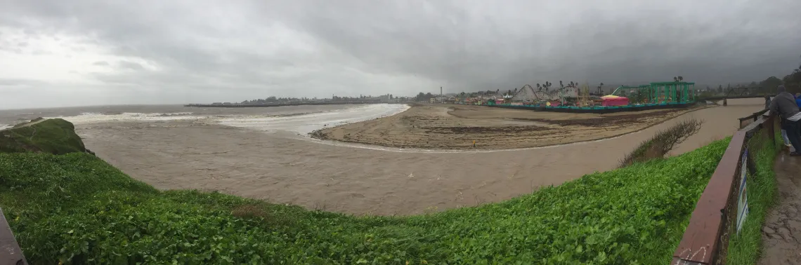 Photograph of a river with encroaching storm clouds.