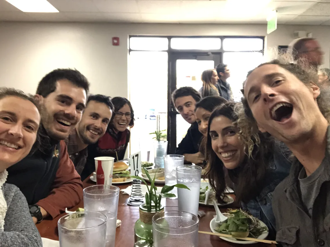 NWRD fellows eating together at a restaurant and having a good time.