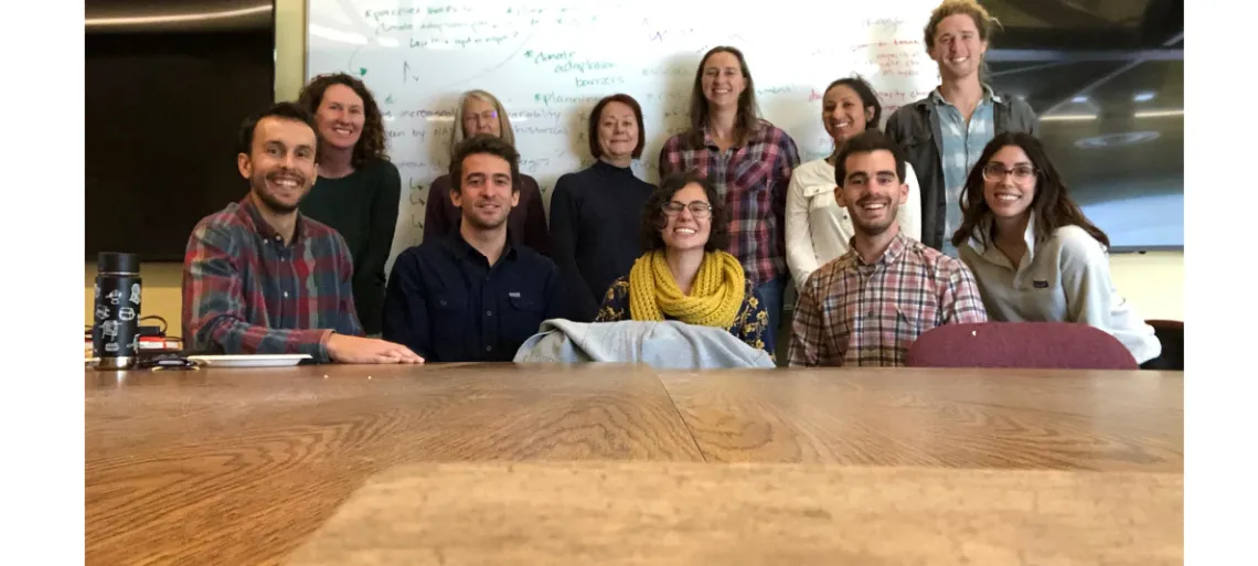 The 2019 group of NRWD fellows sitting at a conference room table posing for a group photo.