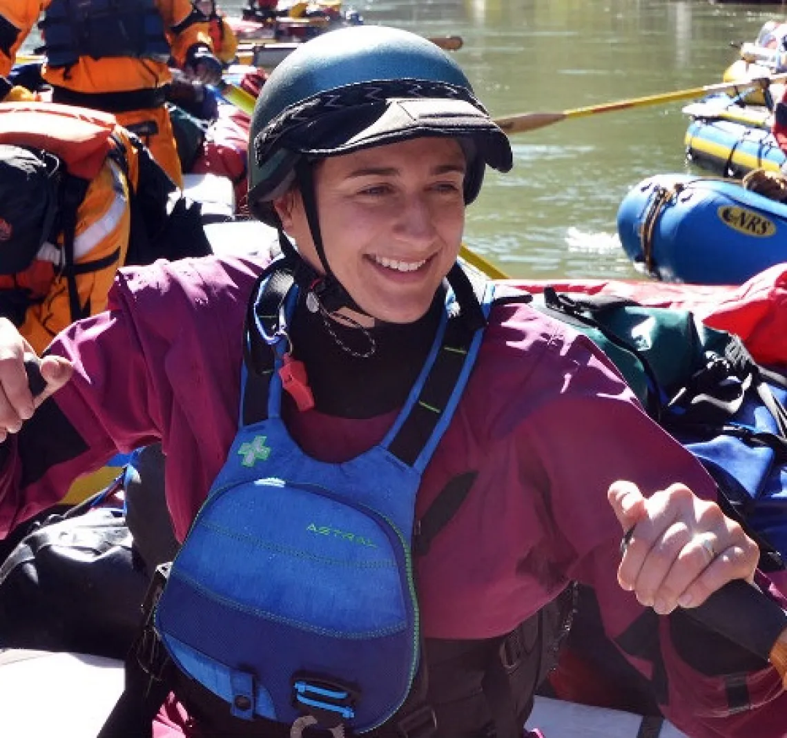 Ann Willis in a raft with other people on a river